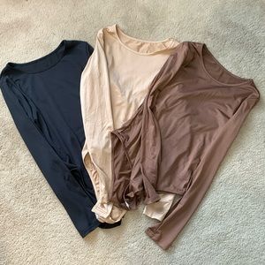 Three long sleeve bodysuits